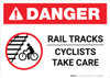 Danger: Rail Tracks - Cyclists Take Care ANSI Landscape - Wall Sign Danger: Rail Tracks - Cyclists Take Care ANSI Landscape - Wall Sign