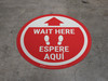 Wait Here - Red Circle - Bilingual Spanish - Floor Sign