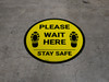 Please Wait Here Stay Safe Shoe Prints Yellow Circular - Floor Sign