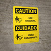 Caution: Use Handrail Bilingual Spanish With Icon - Wall Sign Caution: Use Handrail Bilingual Spanish With Icon - Wall Sign