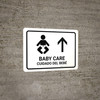 Baby Care With Up Arrow White Bilingual Spanish Landscape - Wall Sign