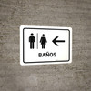 Restrooms With Left Arrow White Spanish Landscape - Wall Sign