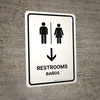 Restrooms With Down Arrow White Bilingual Spanish Portrait - Wall Sign
