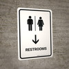 Restrooms With Down Arrow White Portrait - Wall Sign Restrooms With Down Arrow White Portrait - Wall Sign