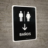 Restrooms With Down Arrow Black Spanish Portrait - Wall Sign