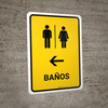 Restrooms With Left Arrow Yellow Spanish Portrait - Wall Sign