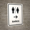 Restrooms With Right Arrow White Spanish Portrait - Wall Sign Restrooms With Right Arrow White Spanish Portrait - Wall Sign