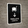 Trolleys With Down Arrow Black Bilingual Spanish Portrait - Wall Sign