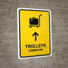Trolleys With Up Arrow Yellow Bilingual Spanish Portrait - Wall Sign