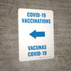 Covid-19 Vaccinations Arrow Left Bilingual Spanish Portrait - Wall Sign Covid-19 Vaccinations Arrow Left Bilingual Spanish Portrait - Wall Sign