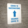 Covid-19 Vaccinations Arrow Up Bilingual Spanish Portrait - Wall Sign Covid-19 Vaccinations Arrow Up Bilingual Spanish Portrait - Wall Sign