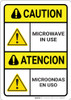 Danger: Microwave in Use with Graphic ANSI Bilingual Spanish - Wall Sign Danger: Microwave in Use with Graphic ANSI Bilingual Spanish - Wall Sign