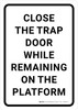 Close the Trap Door While Remaining on the Platform Portrait - Wall Sign Close the Trap Door While Remaining on the Platform Portrait - Wall Sign