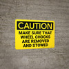Caution: Make Sure Wheel Chocks Are Removed and Stowed - Wall Sign