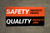 Safety Protects People - Quality Protects Jobs - Orange Black Banner