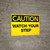 Caution Watch Your Step Wall Sign