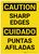 Caution: Sharp Edges Bilingual Spanish - Label
