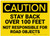 Caution: Stay Back over 100 Ft Not Responsible for Road Objects - Label