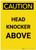 Caution: Head Knocker Above Portrait - Label