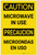 Caution: Microwave in Use Bilingual Spanish - Label