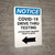 Notice: COVID-19 Drive Thru Testing Left Arrow Portrait - Wall Sign