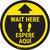 Wait Here - Yellow Circle - Bilingual Spanish - Floor Sign