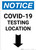 Notice: COVID-19 Testing Location Down Arrow Portrait - Wall Sign