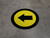Left Arrow Yellow with Black Border Circular - Floor Sign