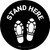 Stand Here with Shoe Prints Black Circular - Floor Sign
