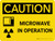 Caution: Microwave In Operation Landscape With Icon - Wall Sign