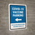 Covid-19 Vaccine Parking: Left Arrow Bilingual Spanish Portrait - Wall Sign