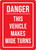 Danger - This Vehicle Makes Wide Turns Red Portrait - Wall Sign