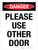Danger: Please Use Other Door Portrait - Wall Sign