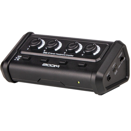 Zoom ZHA-4 headphone amplifier in a black rectangular housing with four top-mounted volume knobs, front panel buttons and indicator lights, and input/output ports for multiple headphone connections.