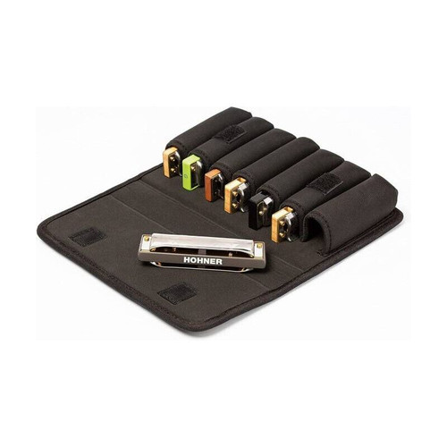 An open Hohner FlexCase M harmonica case holding six harmonicas in individual slots, with one placed horizontally at the bottom, showing the Hohner logo.