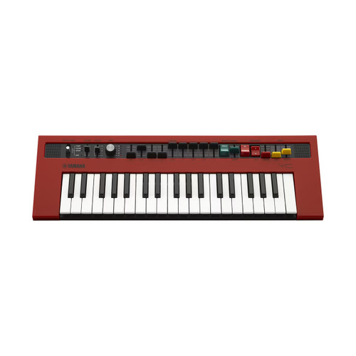 A red electronic keyboard with 37 keys, various buttons, knobs, and switches on the top panel for controlling different functions