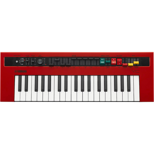 A red electronic keyboard with 37 keys, various buttons, knobs, and switches on the top panel for controlling different functions