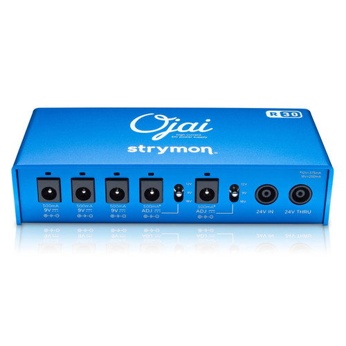 A blue Strymon Ojai R30 power supply unit with five 9V DC output jacks, and two additional jacks labeled '24V IN' and '24V THRU.