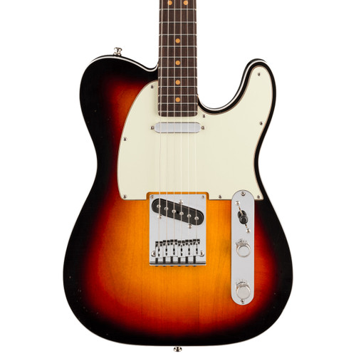 Electric guitar with a sunburst finish, mint green pickguard, two single-coil pickups, control plate with two knobs and a switch, Telecaster-style body.