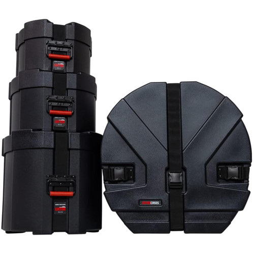 A stack of black Gator drum cases with red latches on a white background.