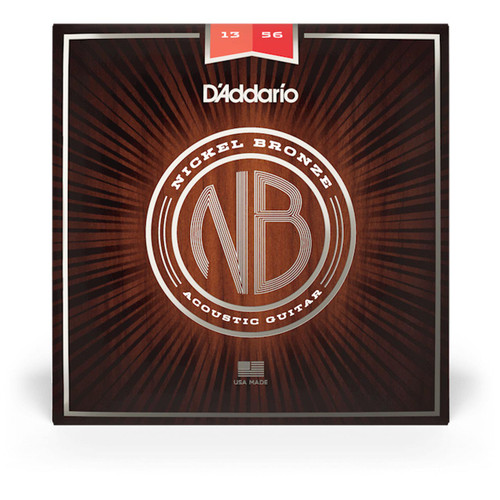 A box of D'Addario nickel bronze acoustic guitar strings with "13-56" specifications shown on a wooden background.