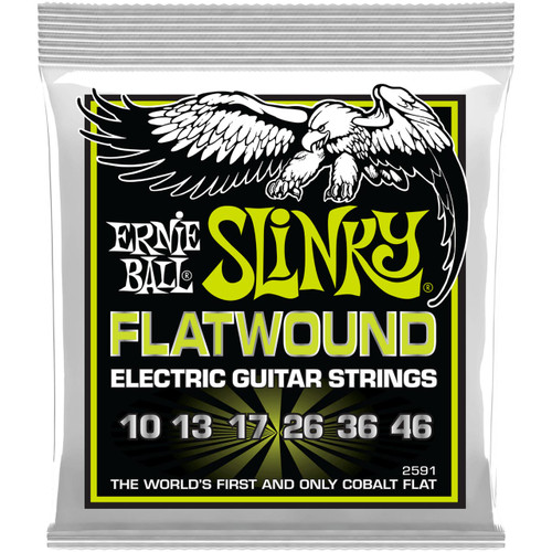 A package of Ernie Ball Slinky flatwound electric guitar strings with specifications visible on the label.