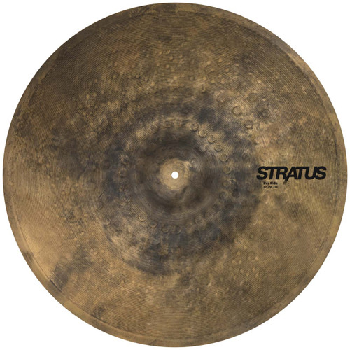 Overhead, top-down view of a circular Sabian Stratus Dry Ride cymbal featuring a heavily hammered, dark, raw bronze finish with the "STRATUS Dry Ride" logo printed in black on the right side.