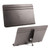 Front and back views of black metal tabletop stand with flat grooved surface, adjustable hinged support, and tightening knob for angle positioning.