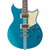 Front view of a Yamaha electric guitar in blue with centered, white racing stripes with two humbuckers and a black pickguard.