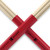 ProMark Thunder Rods drumsticks with red grip sections crossing each other against a white background.