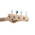 Detailed close-up of the light wood headstock of a Tagima TBA-73 Antique Series bass guitar. The headstock displays the prominent black "Tagima" logo, model script "TBA-73", and "Antique Series" branding alongside four chrome tuning pegs and string trees on a stark white background.
