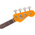 Close-up front view of a vintage Fender Precision Bass headstock with cloverleaf tuners, a signature logo decal, a round string tree, and a dark rosewood fretboard.