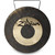 Close-up of a circular bronze Zildjian gong with a dark, textured, unlathed outer rim and center. A bright, polished gold-colored circular band runs through the middle, featuring the black stylized Zildjian logo written across it. A thin black hanging wire is attached to the top rim.