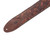 Close-up of Levy's Sundance Series guitar strap in Geranium Whiskey, featuring embossed floral and leaf patterns, a stitched brown leather end with an attachment hole, and stitched cross-like design around the strap-button hole.